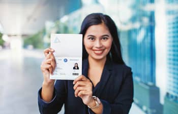 Fictional Photo – A girl holding Passport